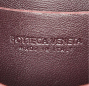 Pochette-cintura Bottega Veneta Cassette in pelle intrecciata plum