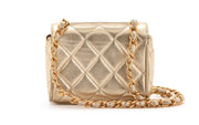 Chanel
Metallic Gold Quilted Lambskin Mini Flap Gold Hardware, 1994-1996